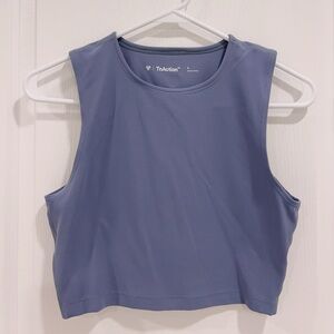 TnAction
TnaBUTTER™ Muscle Hip Tank Umbra Blue color